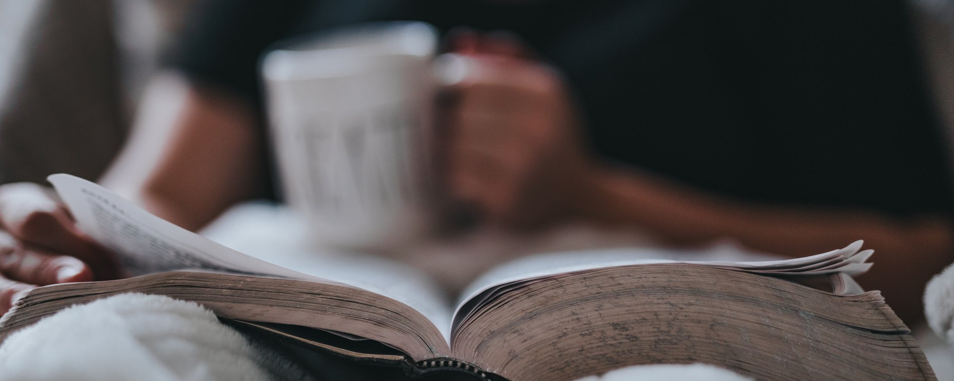 Reading in bed with tea