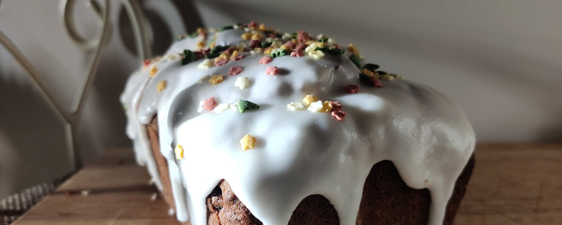 Christmas Loaf with dried fruit, zesty lemon icing and coloured sugar sprinkles