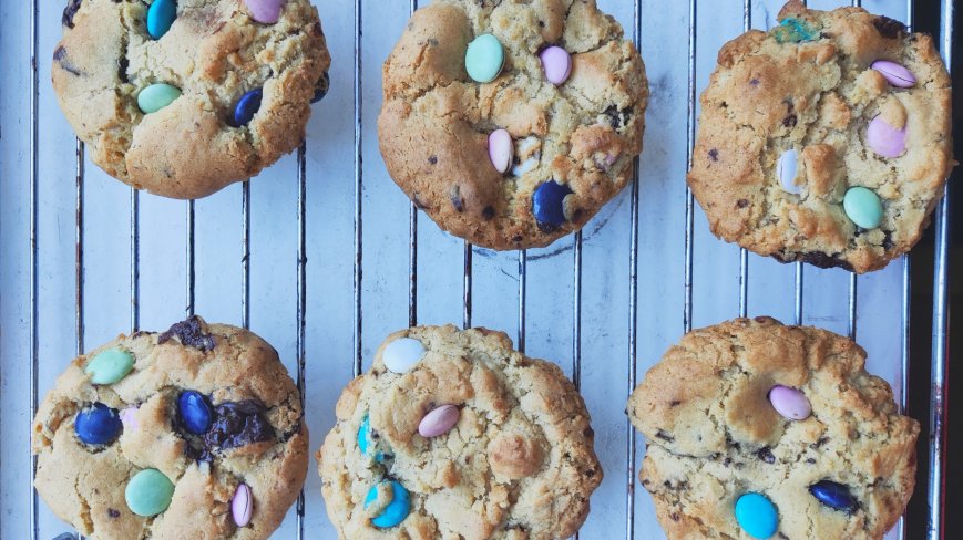 Smarties Cookies. Six cookies on a tray.